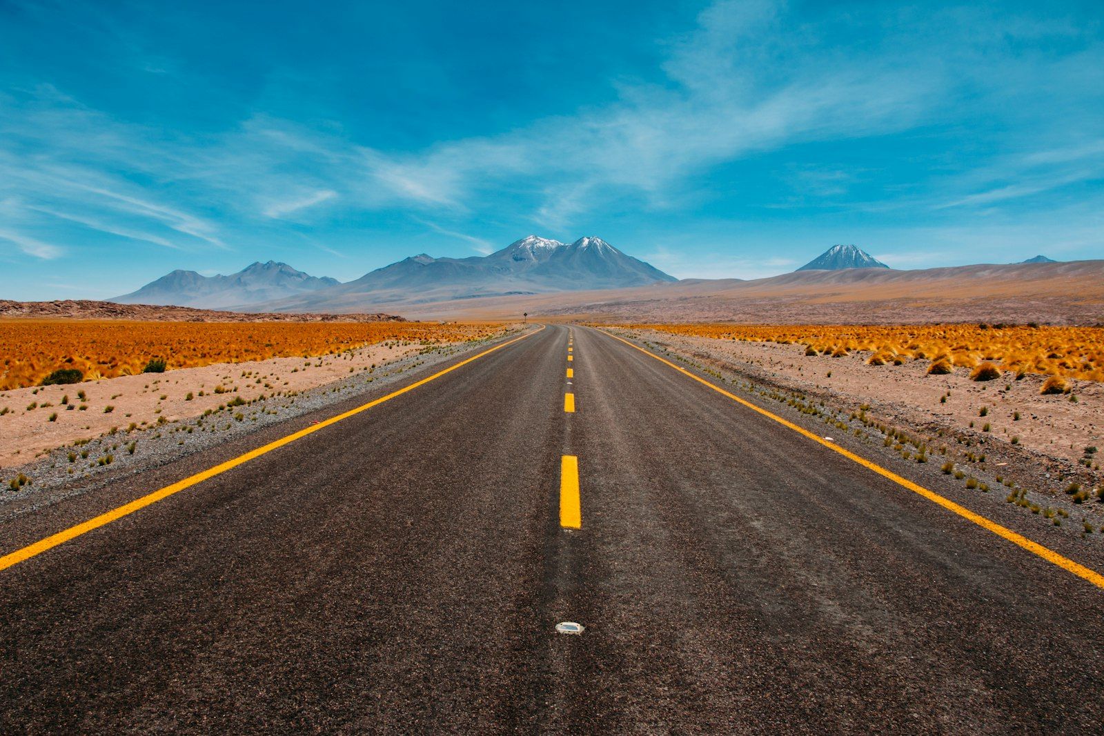 Open highway stretching towards distant mountains